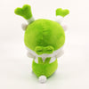 A photo of the Fukkachan Maracas Plushie from the back. Fukkachan has a little bow on the back of their hat, and a round bunny-like white tail coming out of their green suspenders. As they say in America, Fukkachan GOT CAKE! And not the edible kind.