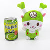 The Fukkachan Maracas Plushie next to a can of 'Motenashi Ujimatcha Latte'. The Fukkachan Maracas Plushie is just a little bit taller than the can of matcha latte, mostly because of Fukkachan's green onion horns. This picture is meant to show how the Fukkachan Maracas Plushie is a little bit bigger than a can.